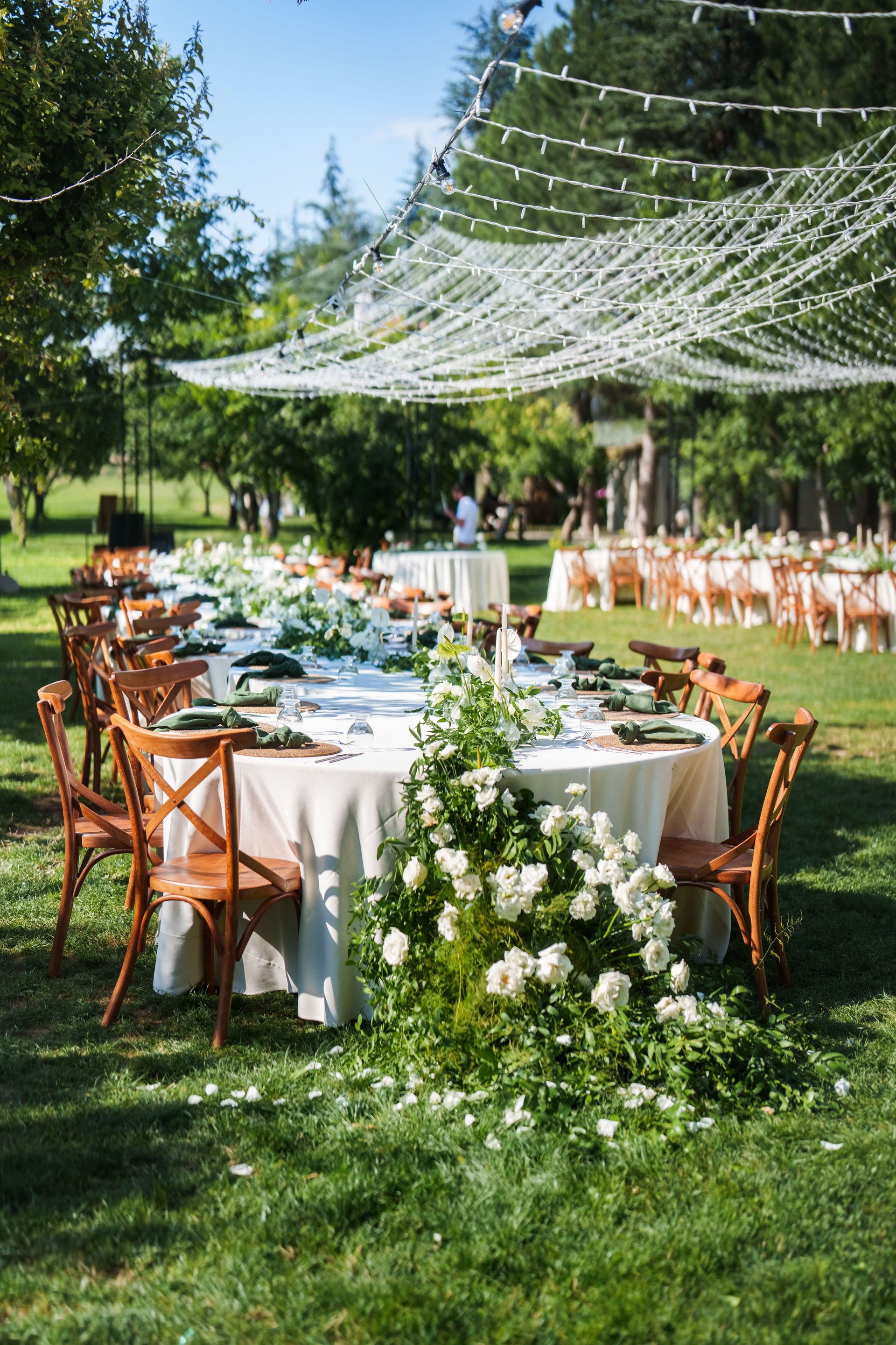 Tables decorated with flowers for a rustic wedding reception